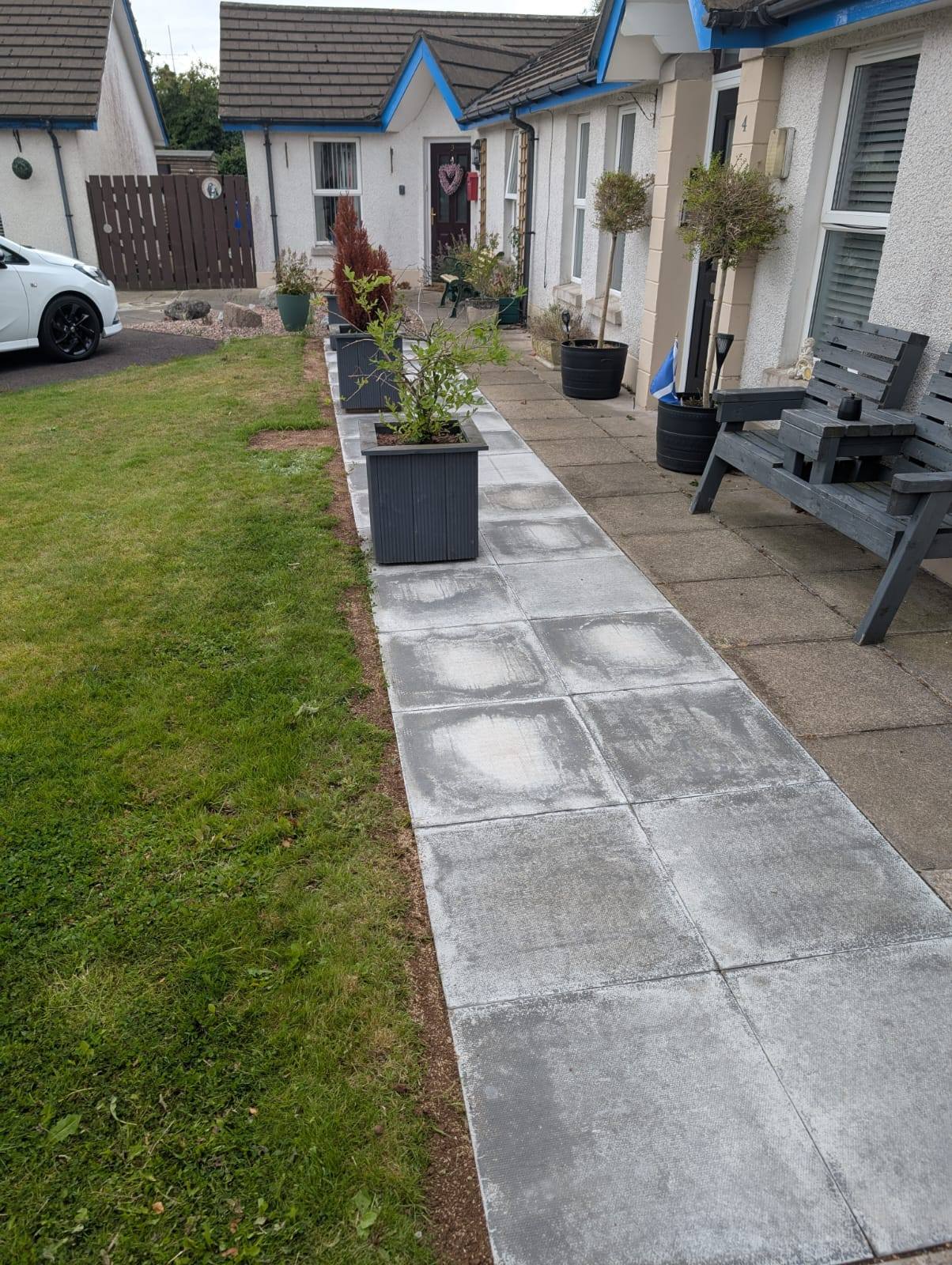 New concrete slabs for pathway outside residential homes in County Antrim