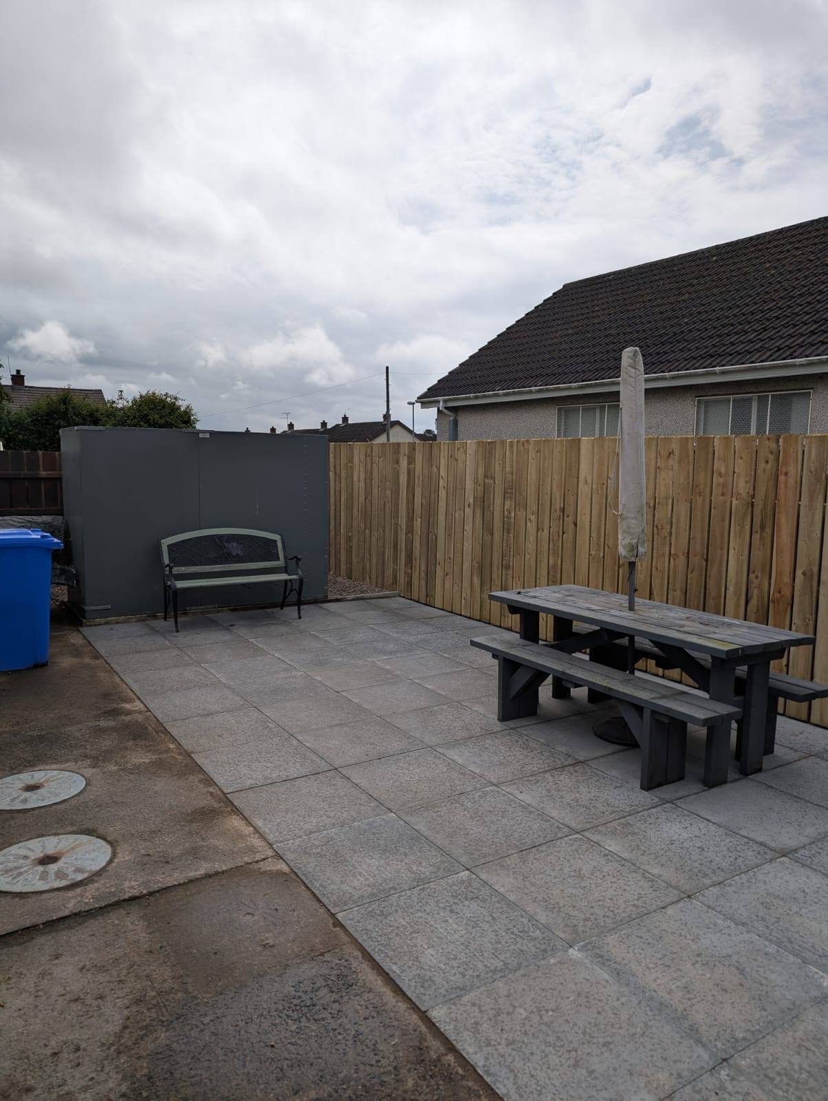 New fence and concrete slab in garden for a house in County Antrim